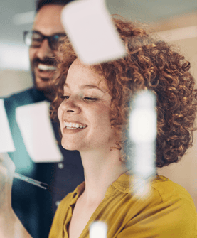 woman smiling writing